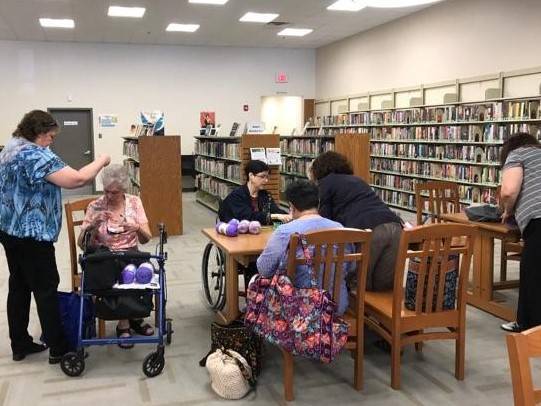 e0480beab918023dc6bf_Needlework_Participants_Inside_Library.jpg