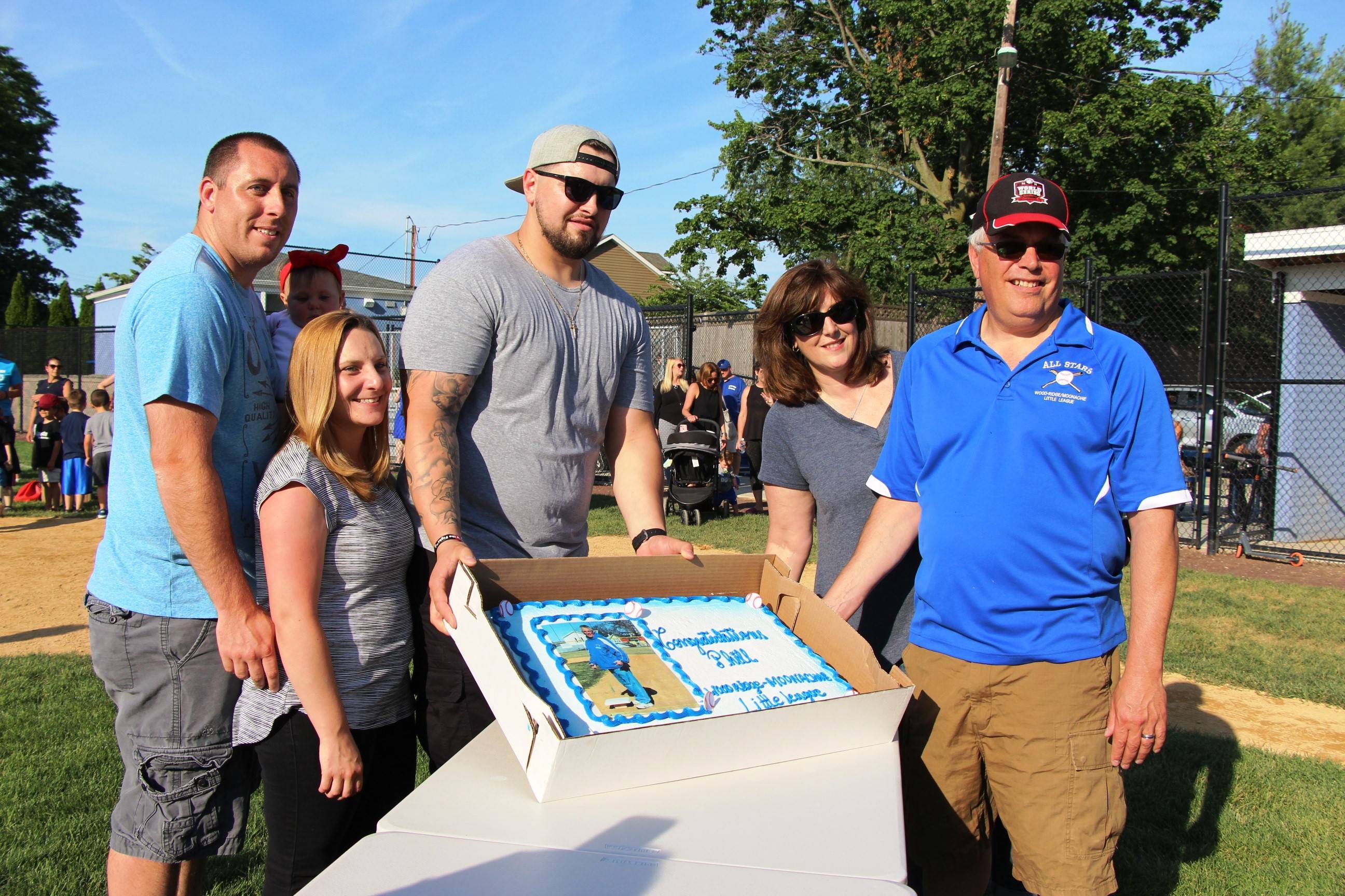 f0e83c6c8d35152fe09d_EDIT_Phil_and_family_and_cake.jpg
