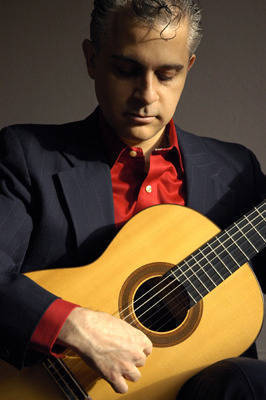 f21a0c2c641bcabc60df_abacfd1a7b2062ae54f5_Thomas_Millioto_With_Classical_Guitar_1287410277.jpg
