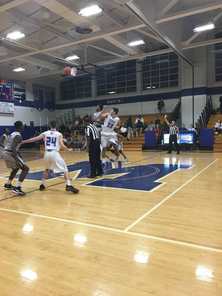 fa96f24cef24f3b51fd5_46db341e7c636fbf0b5f_millburn_basketball_tipoff.jpg