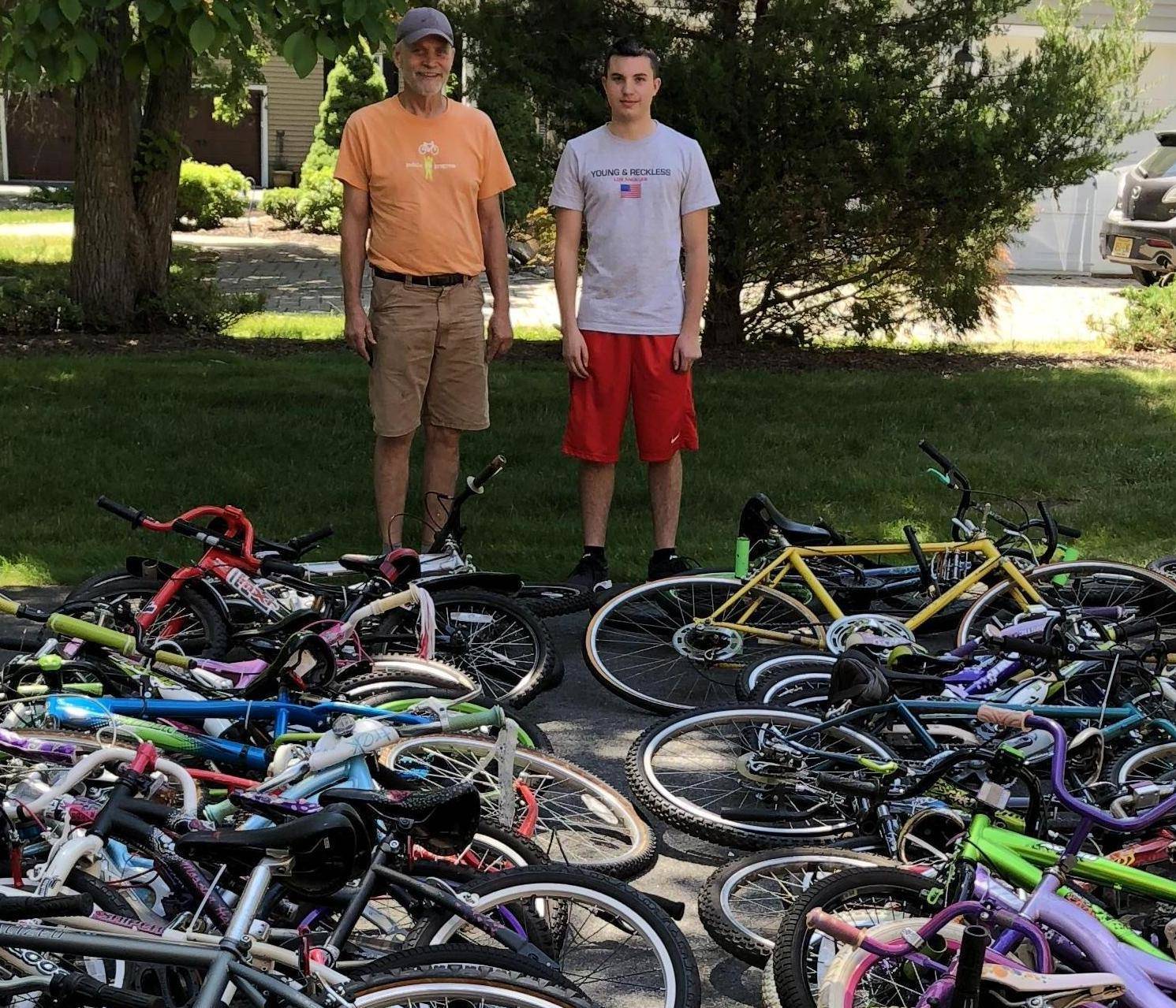 fe3105b09308746ec631_Alex_Iervolino_with_the_volunteer_from_Pedals_for_Progress_who_picked_up_the_43_bikes_he_collected_Courtesy_of_Mary_Iervolino____2._-_crop.jpg
