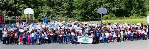 aa9f8e798526c8acbf05_Mt._Pleasant_Elementary_School_Poses_for_a_Picture_at_Annual_Carnival.jpg