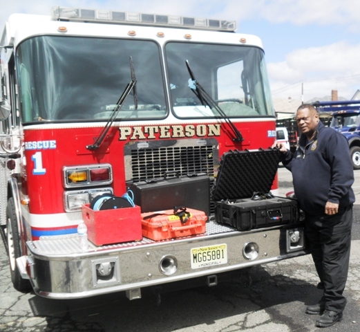 d8591ed40648a791cc95_AP_public_Safety_Director_Glenn_Brown_demonstrates_disaster_equipment.jpg