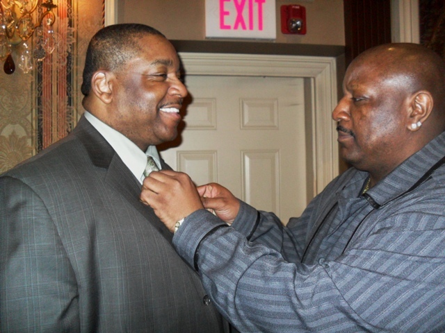 541dfa6c7a6fe472d8f1_AP_LR_Officer_Dwayne_Giles_adjust_Assemblymans_tie_o46.jpg