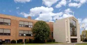 b72792e891d20928b4ad_St._Bart_s_Academy_front.jpg