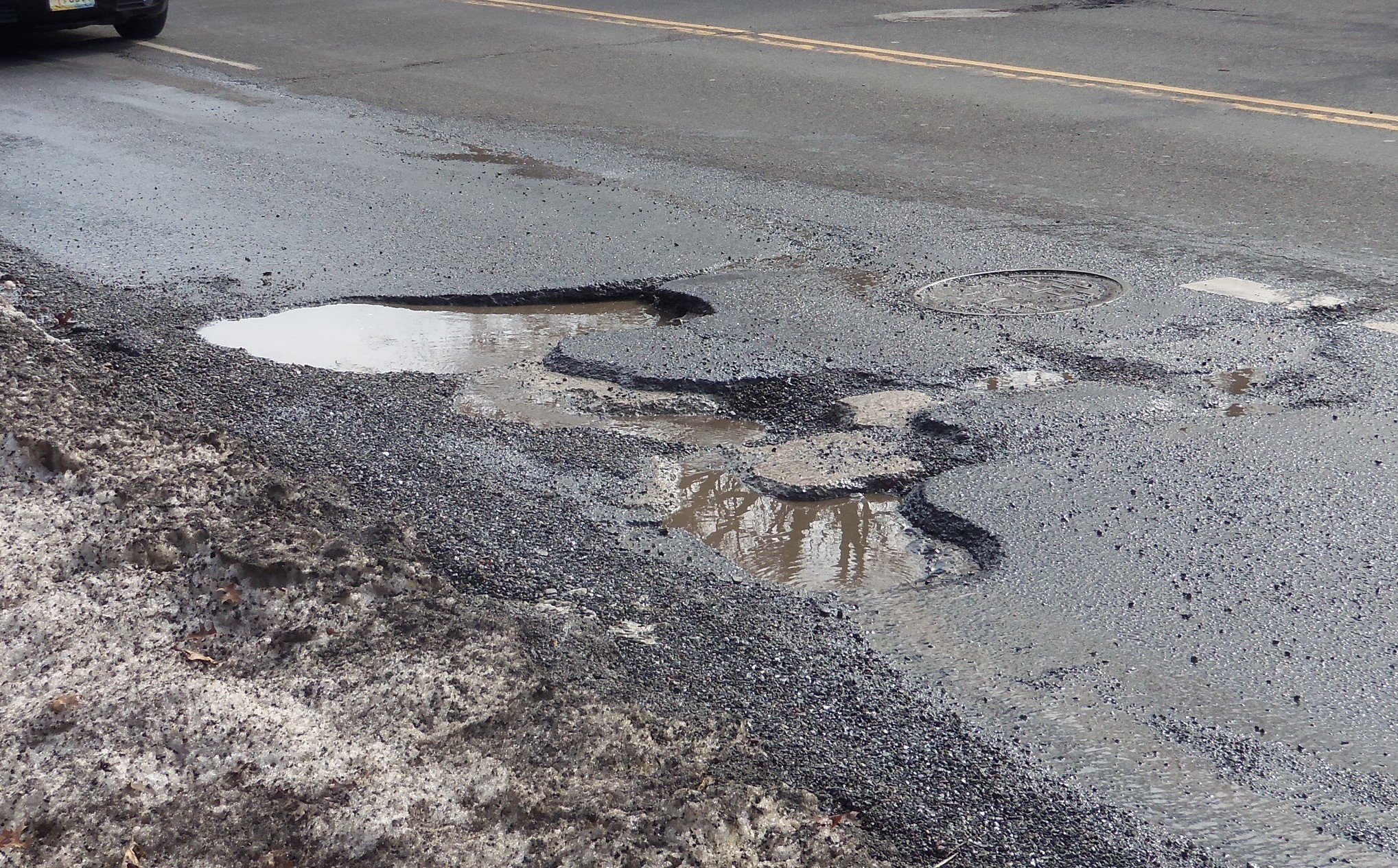 10415a3d5f0d80505d83_pothole.jpg