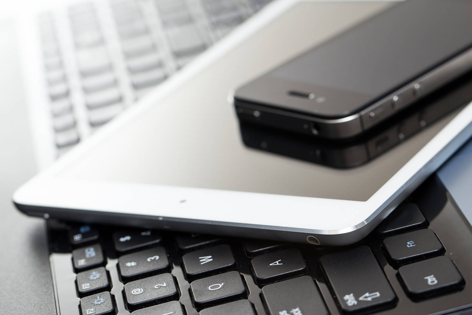 3d4927b8400bc8d18d97_bigstock-Laptop-mobile-and-tablet-on-t-61622459.jpg