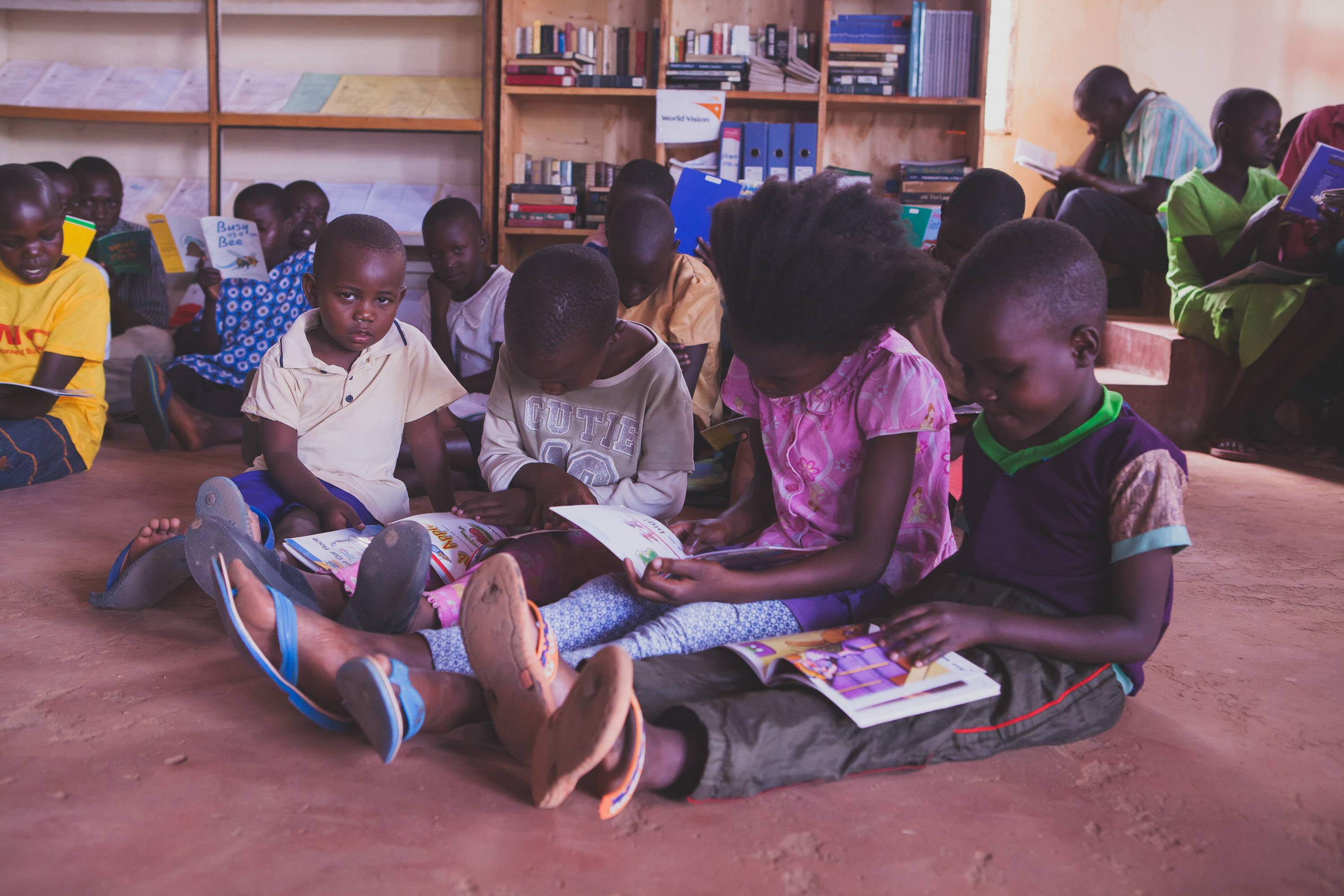 9a3ca8a5871a40fbd302_Children_reading_at_library_NP.jpg