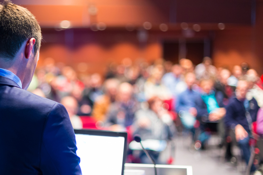 b12351d9c72c8e333c11_Speaker_at_conference.jpg