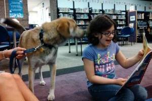 4e8b3f98630bac701bc4_Read_to_a_dog.jpg